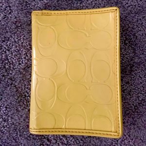 COACH yellow patent leather passport wallet